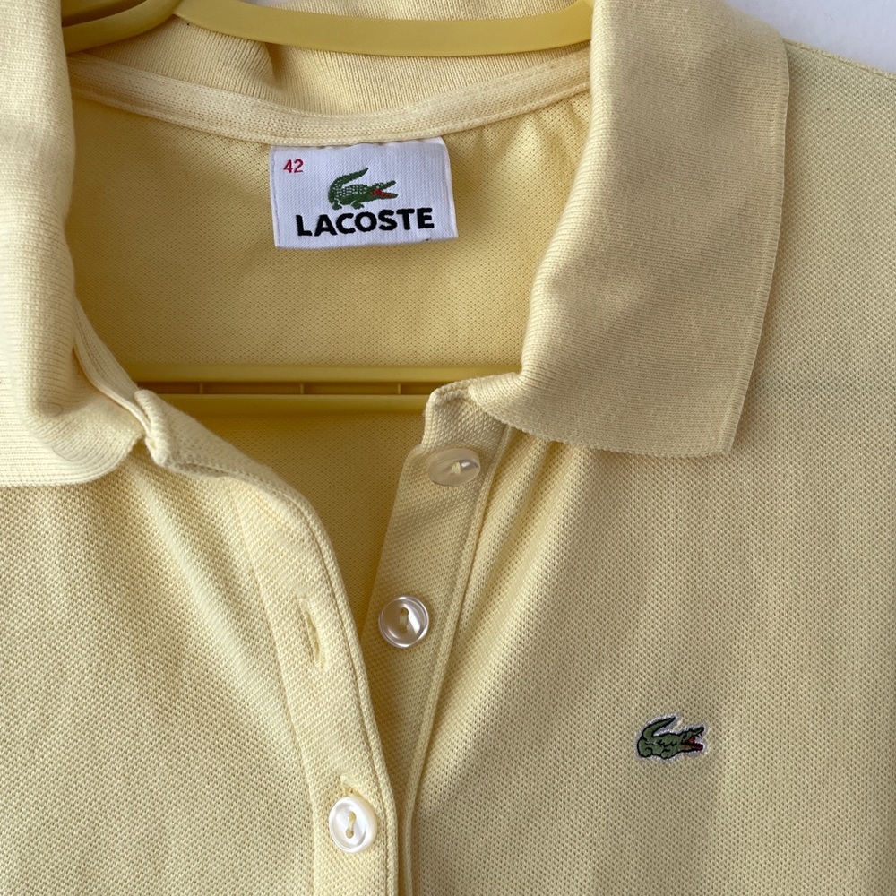 Lacoste golf shirt in a pastel yellow, fits women XS-S